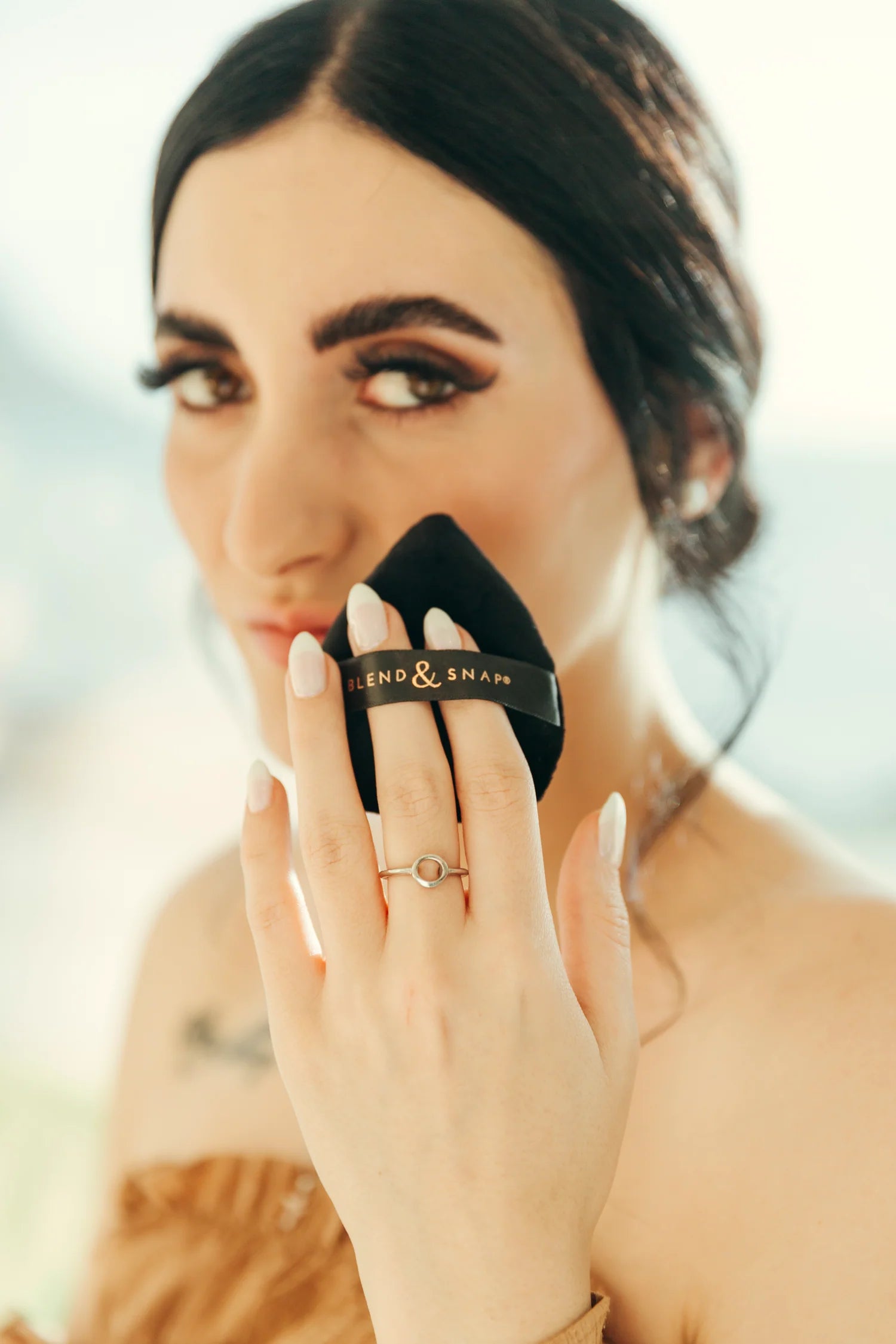 lady using a makeup sponge